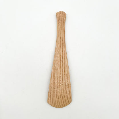 Close-up of the exquisite hand-planed facets on Okubo House wooden rice paddle
