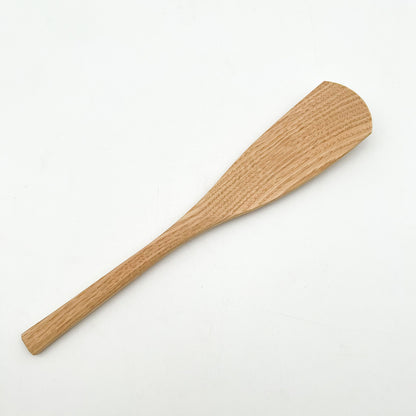 Stirring fresh ingredients in a premium skillet with Okubo House ergonomic wood turner