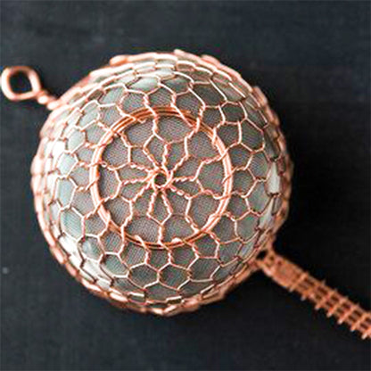 Close-up of beautiful intricate wire-weaving on Tsujiwa Kanaami tea strainer