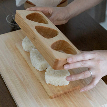 Making batch Japanese triangular rice balls for bento with Umezawa 3-hole wood mold