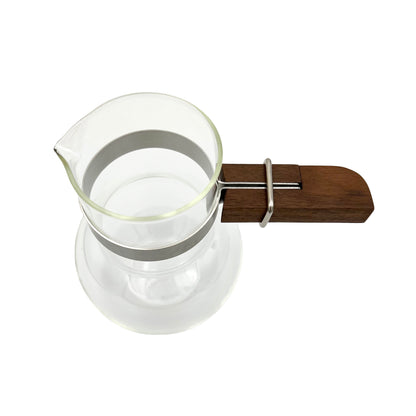 Artisanal handblown Japanese coffee carafe on a mid-century modern kitchen counter