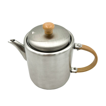 Modernist Japanese stainless steel side-handle kettle on a sleek induction cooktop